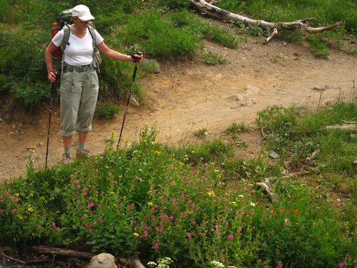 Kathy admiring flowers on way out