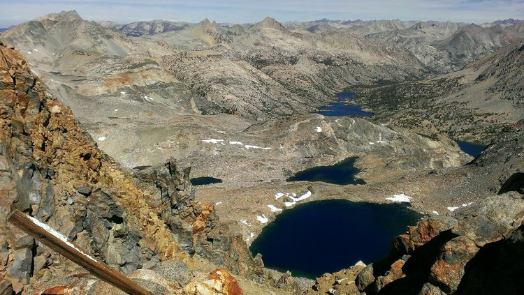Standing atop Gould Pass with the Rae Lakes Basin in the distance.  Dragon Lake is partially visible on the far right.
