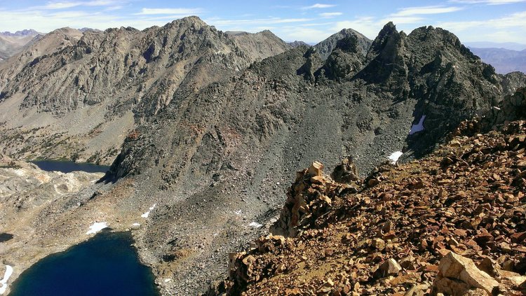 Leaving the radio transmitter and looking from the shoulder above Gould Pass to Dragon Peak with Dragon Lake below on the distant left.  The lake in the left foreground was my next destination.