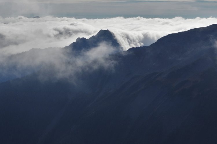 clouds looking like a sea and a waterfall