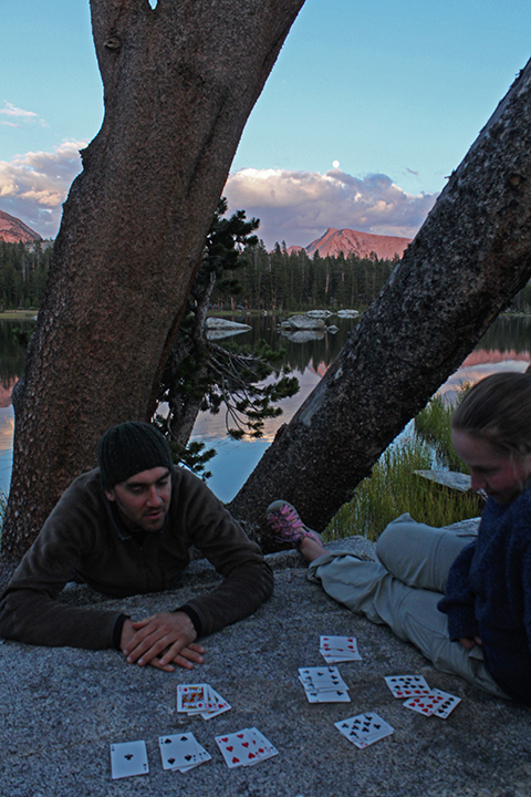 Playing 500 Rummy at Rae Lake with a beautiful sunset over Mount Hutton in the background