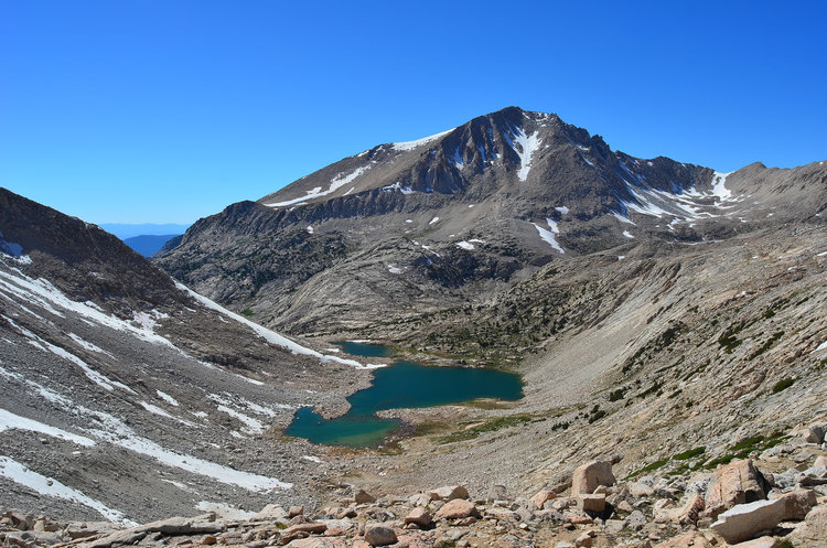 Brown Bear Lake with Mt. Hilgard as a massive hulk rising thousands of feet.