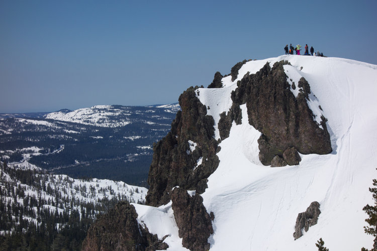 A party of people on the overlook point above Castle Pass.