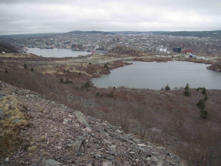 St John's viewed from near the top of Signal Hill. The harbor is on the left, but to the right is a glacial lake, like the ones in the High Sierra but at an elevation of about 350' above sea level.  Newfoundland was completely overrun by glaciers during the Pleistocene ice ages, so we get features like this at low elevations unlike the High Sierra where the lowest elevation cirque lakes are at a bit above 5000'.