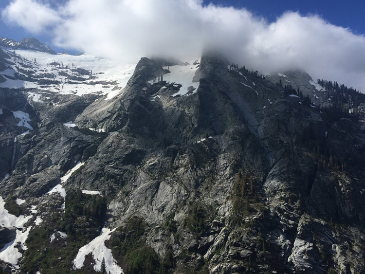 cloud-capped snowy peaks.