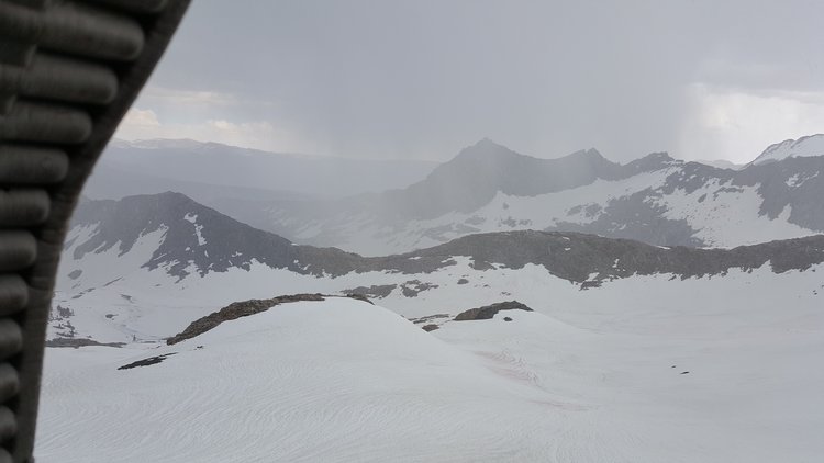 Hunkered under a foam sleeping mat just below Black Rock Pass in hail.