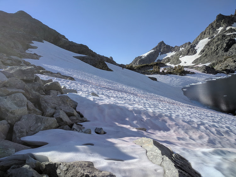 After traversing the snowfield on the east side of Cecile Lake