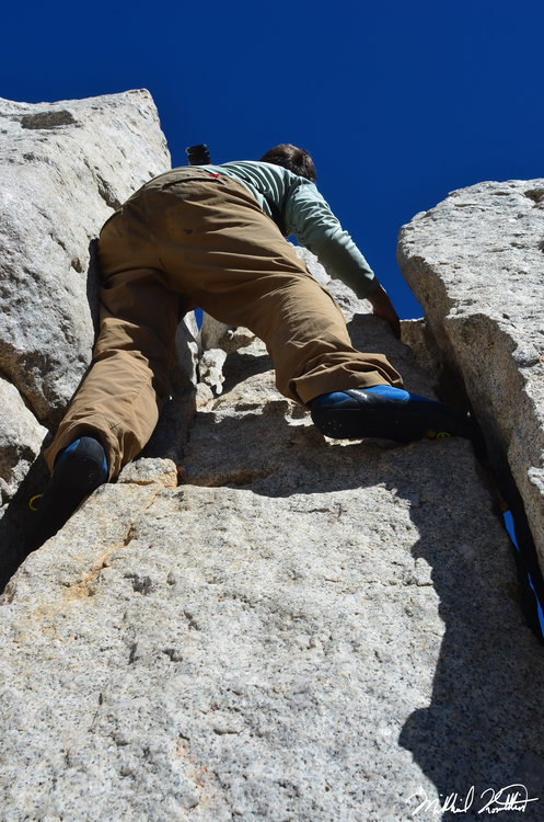 Rogue climbing the 15ft Class 5.2 Cracks to the top of Cathedral Peak. He did this in full on hiking boots several years before he had any experience and now we both had climbing shoes to do it. It was lots of fun!