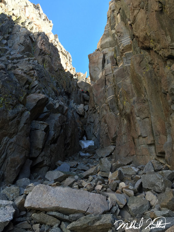 Looking up the chute to the first chockstone. You climb up the wall to the left via some stiff Class 4. Above that lies the 2nd chockstone..