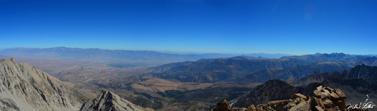 Looking South and East the Owens Valley with Bishop spreads out before you. Thousands of feet below you, you feel as though you are standing on the top of the Sierra. Agassiz and North are both visible to the far right.