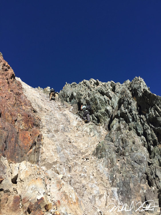 Loose red rock crossover point. Tricky climbing to not let a bunch of rocks loose on your partners below!