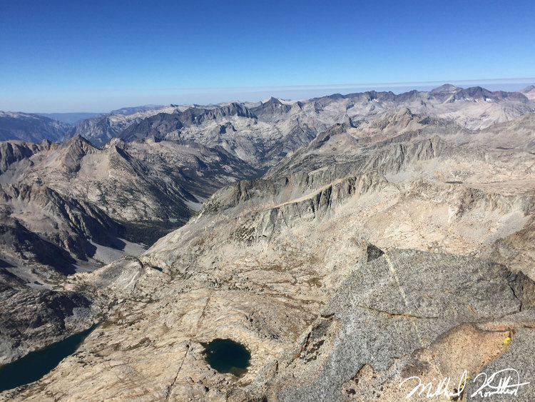 The incredible view on the other side looking down on the lake Rogue and I had stayed at the year before on our climb up Norman Clyde Peak. Right around that lake is a trash can full of old junk from the 80's that was left by a climber as a cache! Oh yeah.. the JMT is down there somewhere too!
