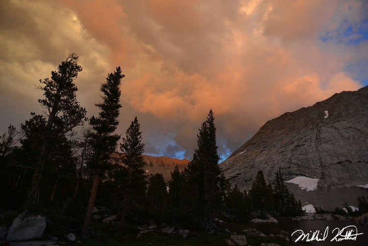 Amazing lighting illuminates sunset clouds around camp.
