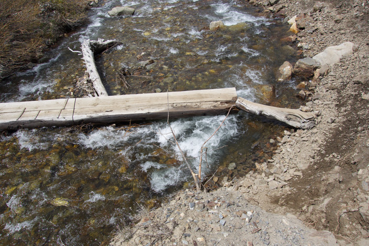 The broken bridge at the first crossing is solid, even with the addition of the new short log.
