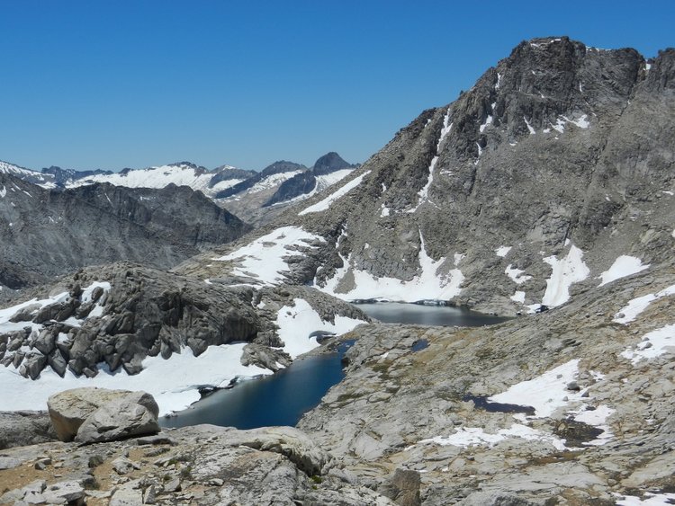 View across the tarn above Southguard Lake with Big Bird basin in the background