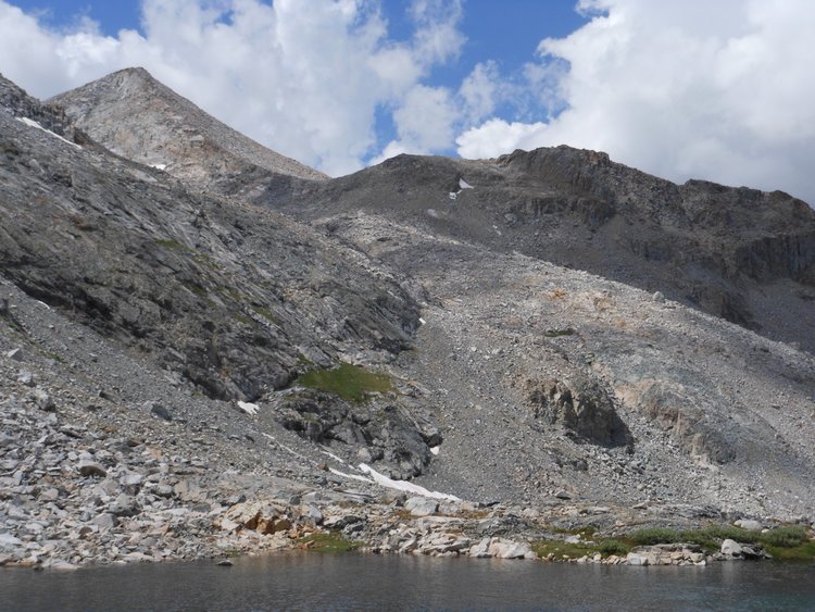 Foerster Ridge from Lake 10217 -- I made my way first to the steeply sloped meadow, then along the base of the wall -- I stayed above the gulley and outlet stream that runs from upper left to lower right