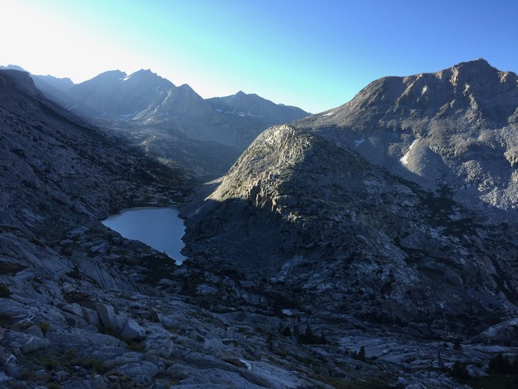 View of Lower Palisade Lake descending cliffs below Cirque Pass