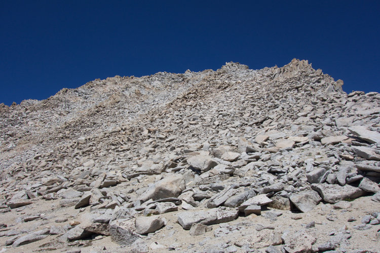 On Mount Brewer's southern slopes, the final approach transitions from scree into stable rock.