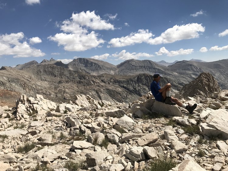 Resting at the ridge: Milestone in the background