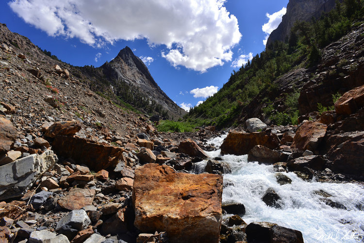 An unnamed peak dominates the view for quite a while with the incredible creek cascading down providing a refreshing need for water in this drier Eastern Sierra desertlike terrain.