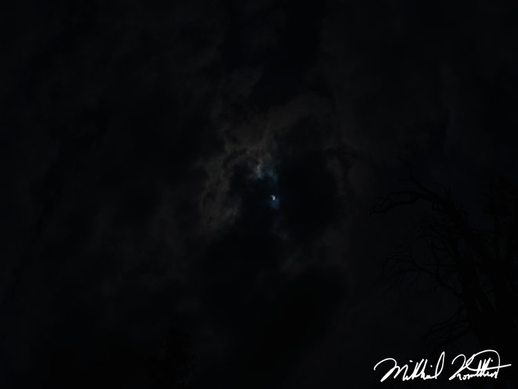 The best photo I could get of the eclipse. The clouds may have helped in some ways. You can see the crescent sun because of the moon in front of it.