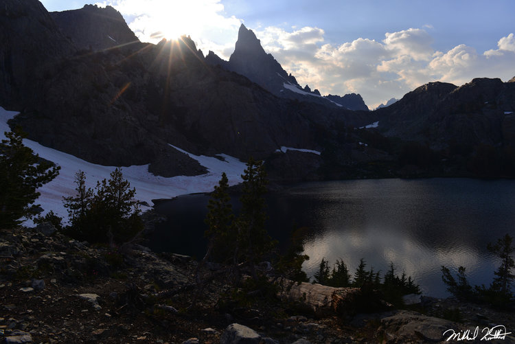 Glorious Minaret Lake with a brilliant sun setting behind a Minaret. The most prominent Minaret is Clyde.