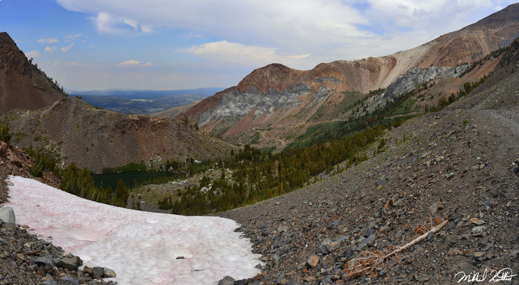 The trail goes on the right side below the multi colored rock. Pretty spectacular area.