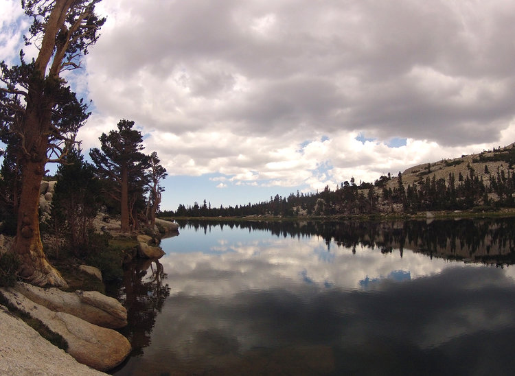 Enjoying some sheet glass before the rain. Day One. Long Lake.