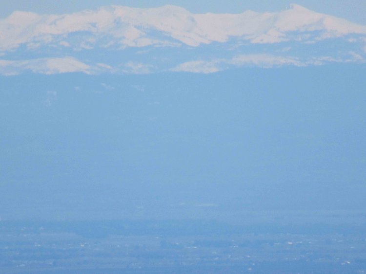 The closest part of the Sierra crest is the distinctive profile of the Crystal Range and Pyramid Peak of Desolation Wilderness
