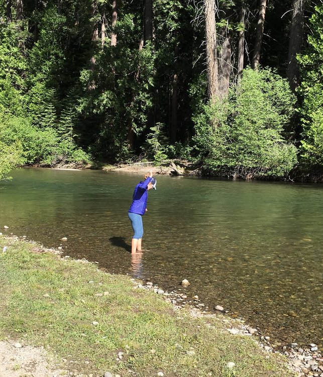 My wife soaking her feet in the Stanislaus River at Kennedy Meadows.