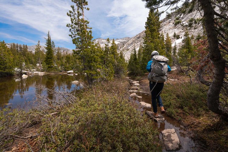 Hiking by the river flowing from Grouse Lake