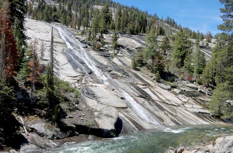 Side creek flowing over slabs into Merced River