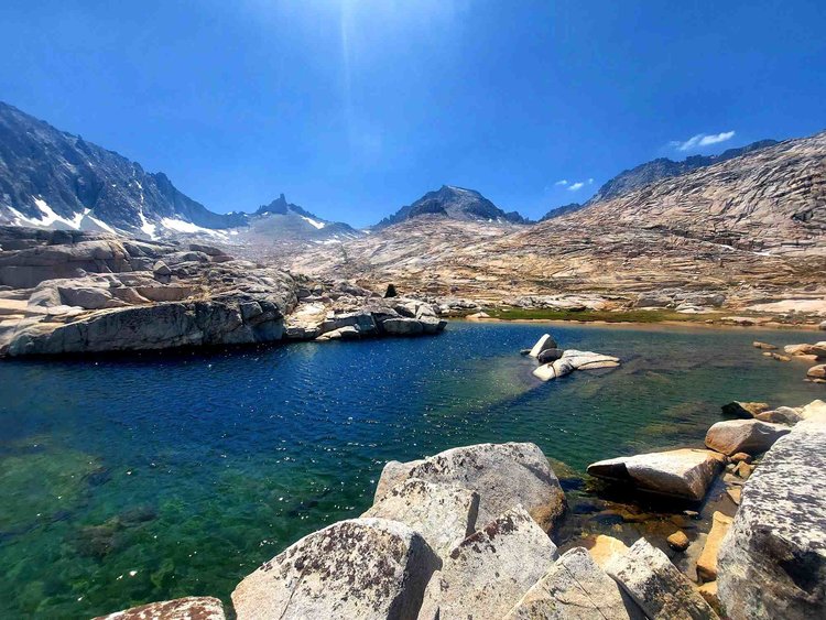 This small lake in the center of Milestone Basin has a sweeping view of all the peaks that enclose it