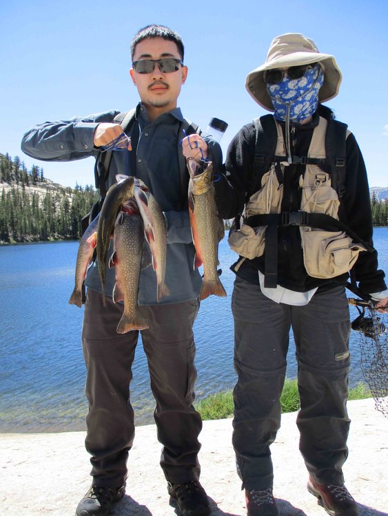 Lee and Judy with their fish; Mrs. Giantbrookie gets biggest fish honors for the trip.