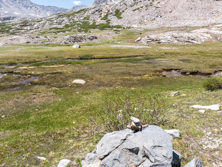 directional cairn pointing at the crossing. not shown are some rebuilt cairns on the other side.