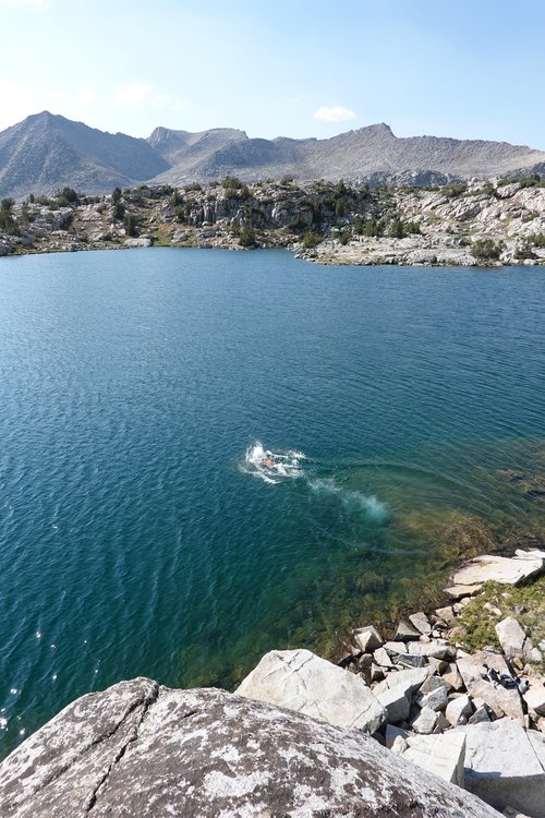 My friend doing laps in the lake.