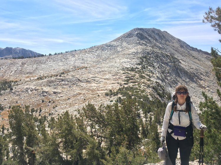 Descending the krummholz maze with Rafferty Peak in the background.