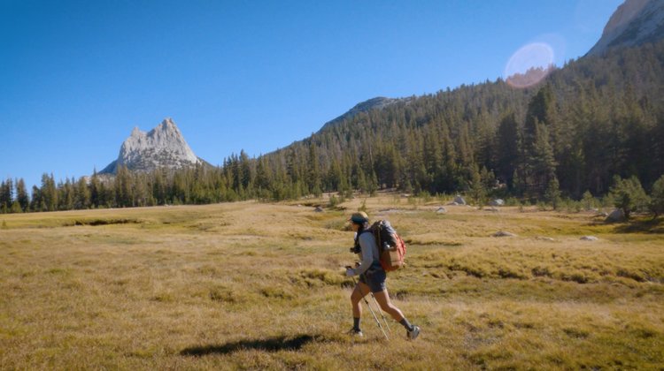 Hiking out under the watchful eye of Cathedral Peak