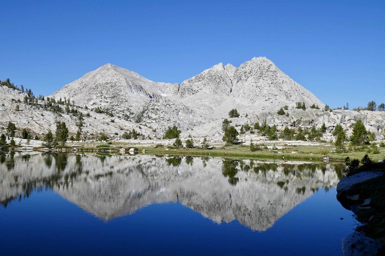 The Hermit reflected in Evolution Lake