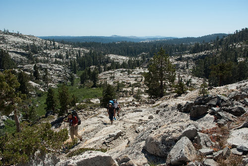 Other hikers approaching Maude on granite
