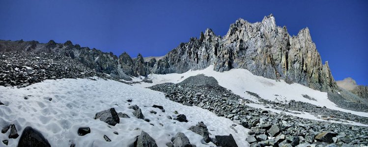 Lane Pass E  (presumably?)- Slightly left of center - The most obvious/large scree fan - Looks like 4th low notch from right/NW from here, looks like 3rd if viewing from top: