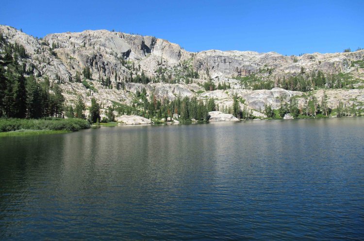 The massively jointed granite walls frame the lake so nicely; the slot canyon outlet from the higher lake is visible on the left.
