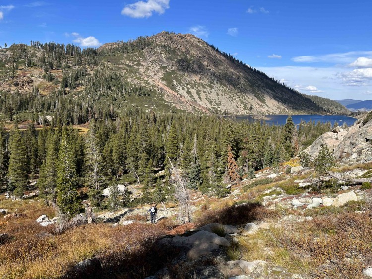 Judy works her way uphill on our off trail ascent from Long Lake to hit the trail.  Mud Lake is to the left.