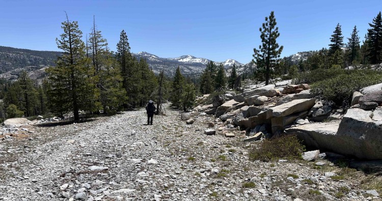 Lee descends toward Buck Island Lake.  The country we hiked over was snow free, but snow lingers not too far above.