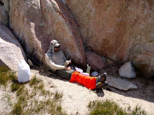 Eating lunch, protected from the sun.