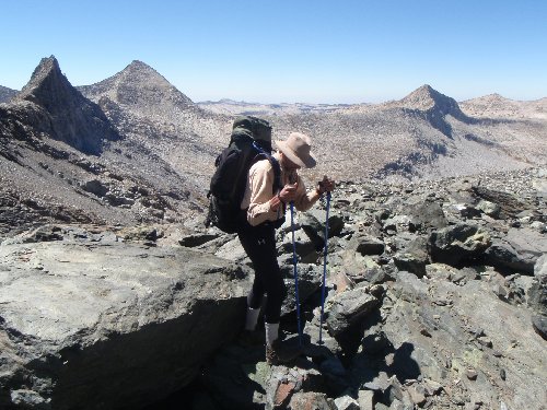 Warren slogs up talus &quot;where the trouble started&quot; on the way to Goddard Creek Pass.  I found the rock fin on the left skyline to be particularly captivating.